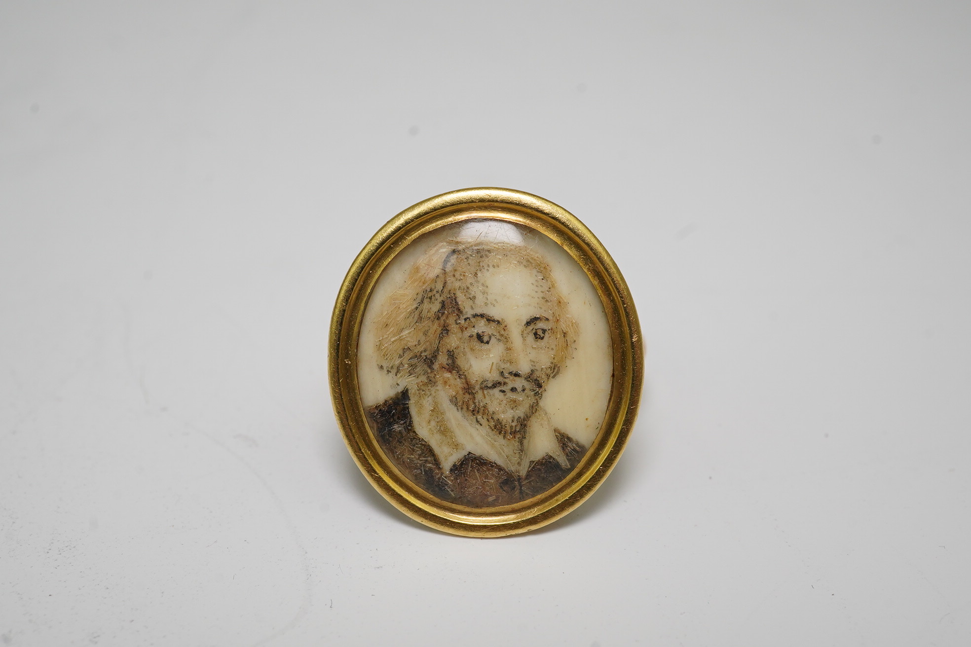 A George III gold mounted painted and hairwork portrait miniature ring